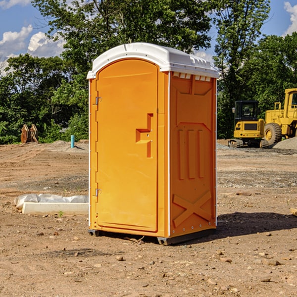 what is the cost difference between standard and deluxe portable toilet rentals in Tioga